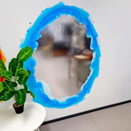 image-Blue & Orange Portal Aura Wall Stickers with Silver Chrome Mirror Effect - Vibrant Oval Teleport Decals for Gamer and Geek Room Decor