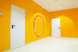 image-Blue & Orange Portal Aura Wall Stickers with Silver Chrome Mirror Effect - Vibrant Oval Teleport Decals for Gamer and Geek Room Decor