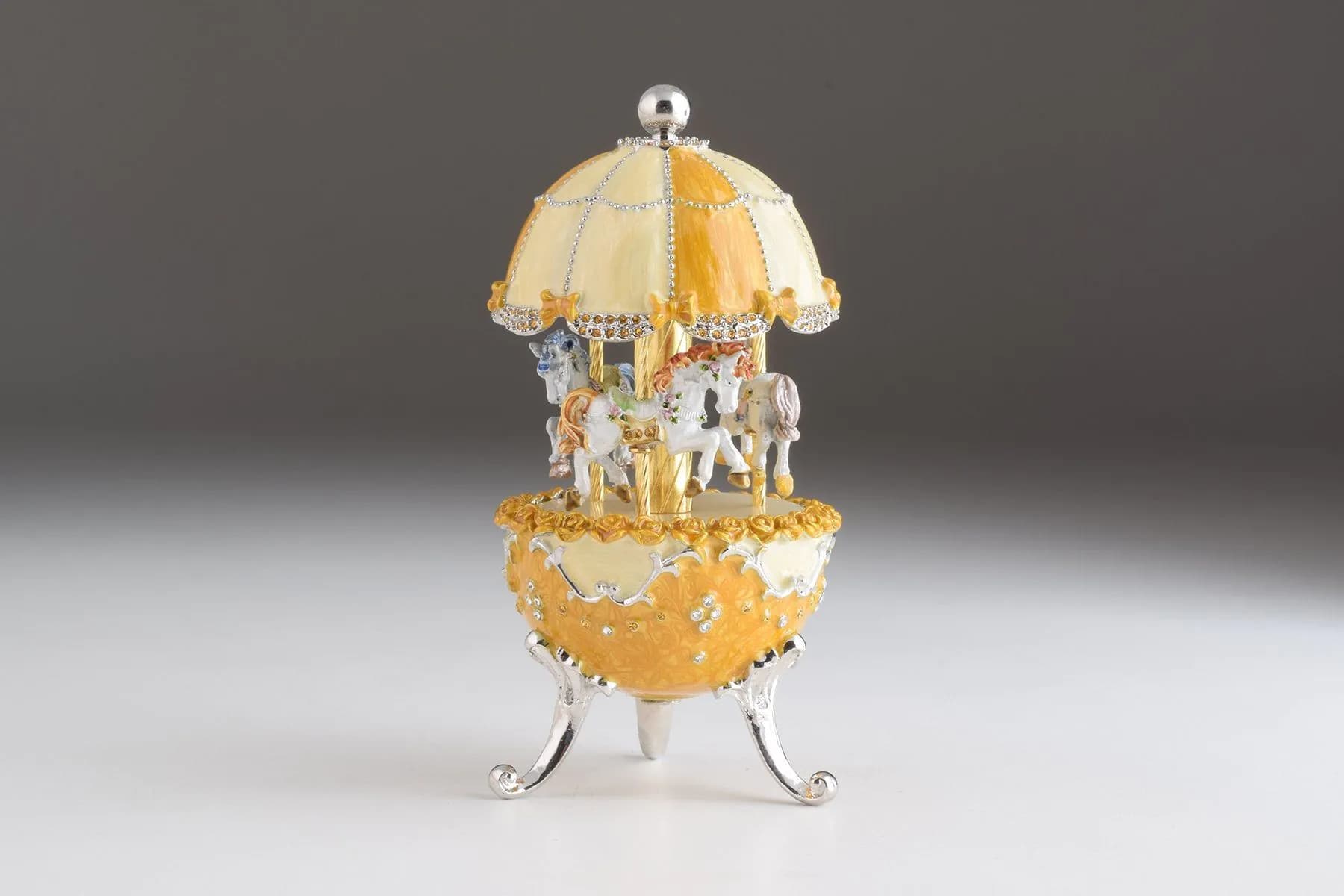 image-Yellow Faberge Egg Carousel Wind up Music Box