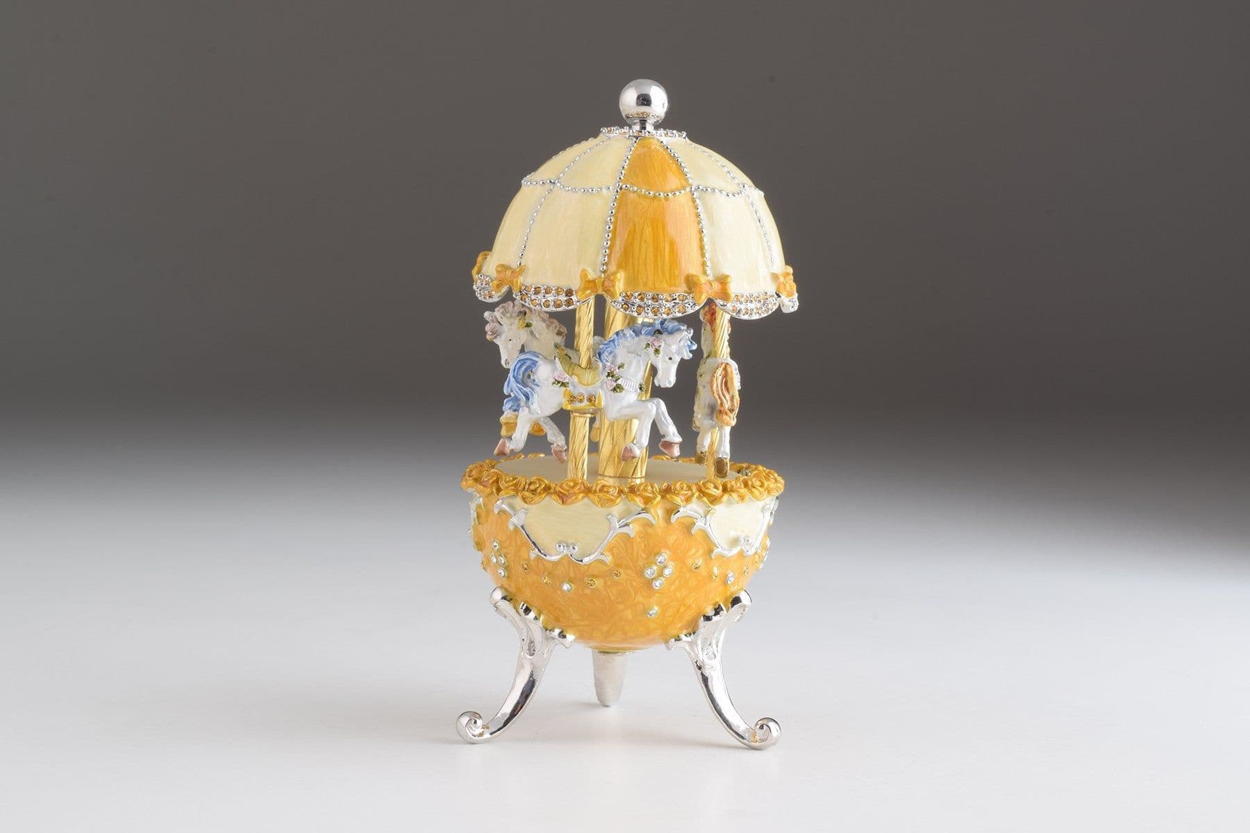 image-Yellow Faberge Egg Carousel Wind up Music Box