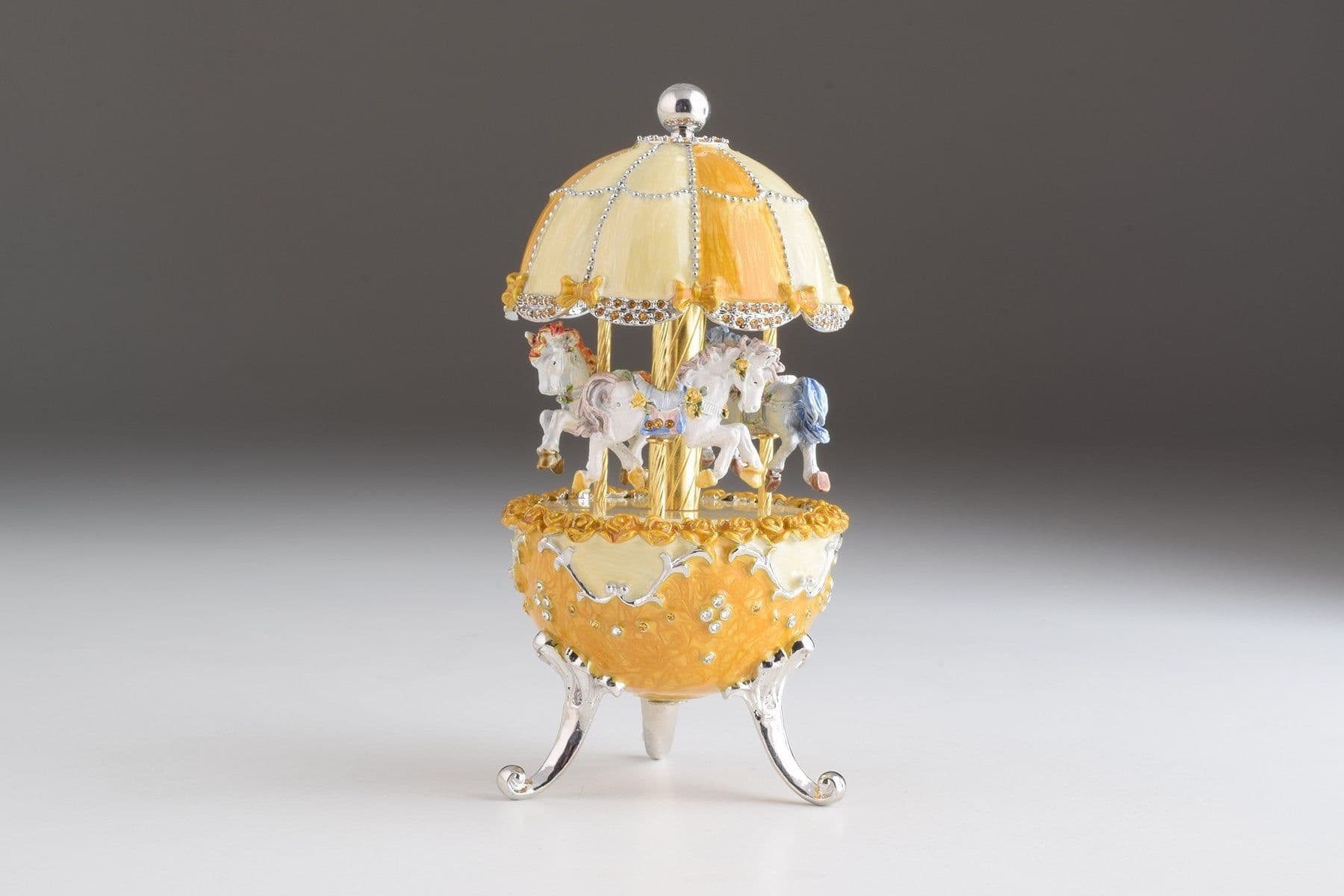 image-Yellow Faberge Egg Carousel Wind up Music Box
