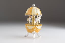 image-Yellow Faberge Egg Carousel Wind up Music Box