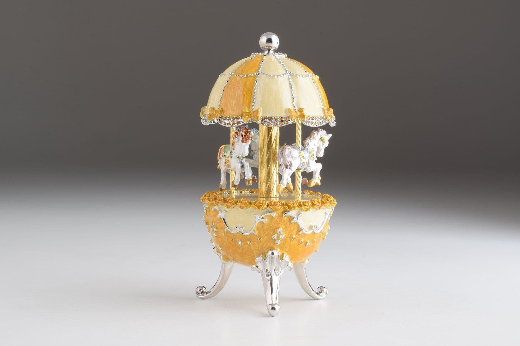 image-Yellow Faberge Egg Carousel Wind up Music Box