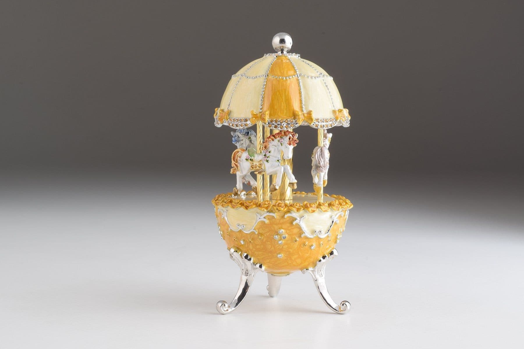 image-Yellow Faberge Egg Carousel Wind up Music Box