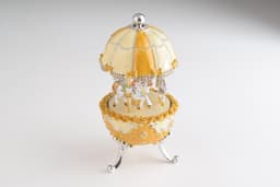 image-Yellow Faberge Egg Carousel Wind up Music Box