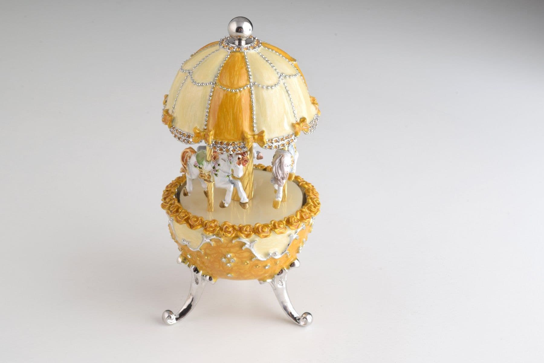 image-Yellow Faberge Egg Carousel Wind up Music Box
