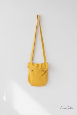 image-Honey Linen Shoulder Bag with Coconut Buttons and Adjustable Strap