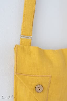 image-Honey Linen Shoulder Bag with Coconut Buttons and Adjustable Strap