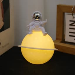 image-Astronaut Sitting in The Moon Night Light Creative Desktop Luminous Planet Lamp Ornament Home Decoration Birthday Kid Gifts
