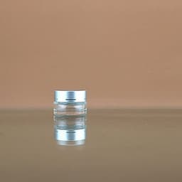image-Transparent Face Cream Bottle Glass Cosmetics