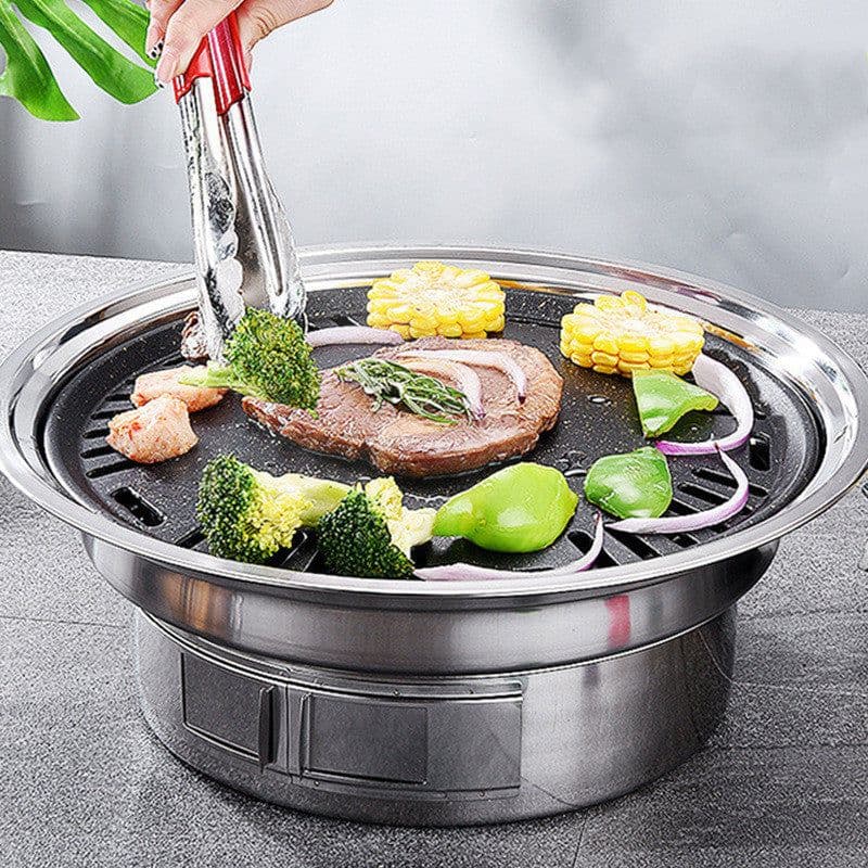 image-Stainless Steel Charcoal Barbecue Grill Korean Non-stick Barbecue Grills Portable Outdoor BBQ Grill Round Carbon Barbecue Stove