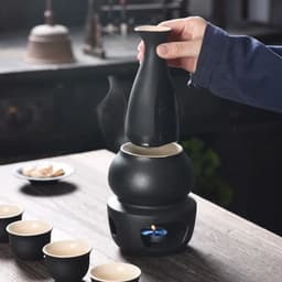 image-Ceramic Sake Set with Warmer Include 1pc Sake Bottle, 4pc Sake Cups, 1pc Warmer Cup, 1pc Candle Heating Stove