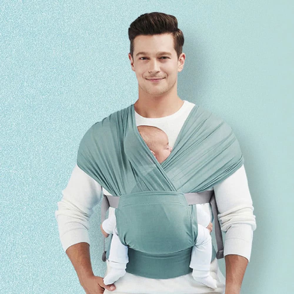 image-Newborn Hugging Baby Sling With Light Hands To Coax Sleep