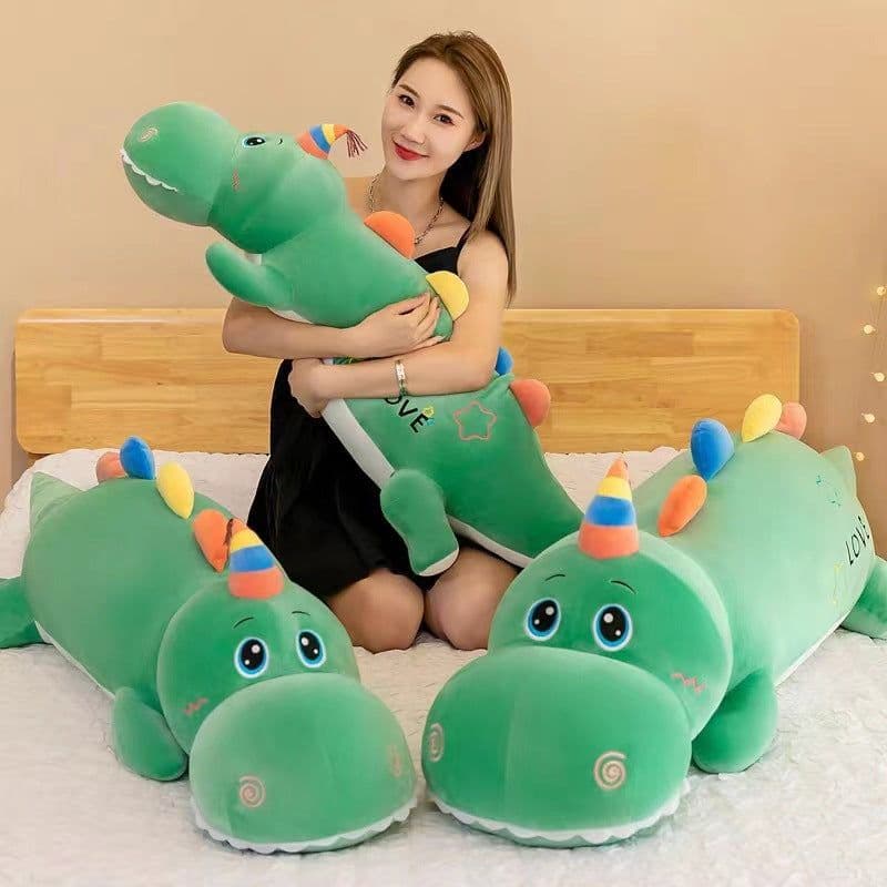 image-Cartoon large long dinosaur plush toy doll for girls to sleep on bed with legs folded and pillow as a birthday gift for girls
