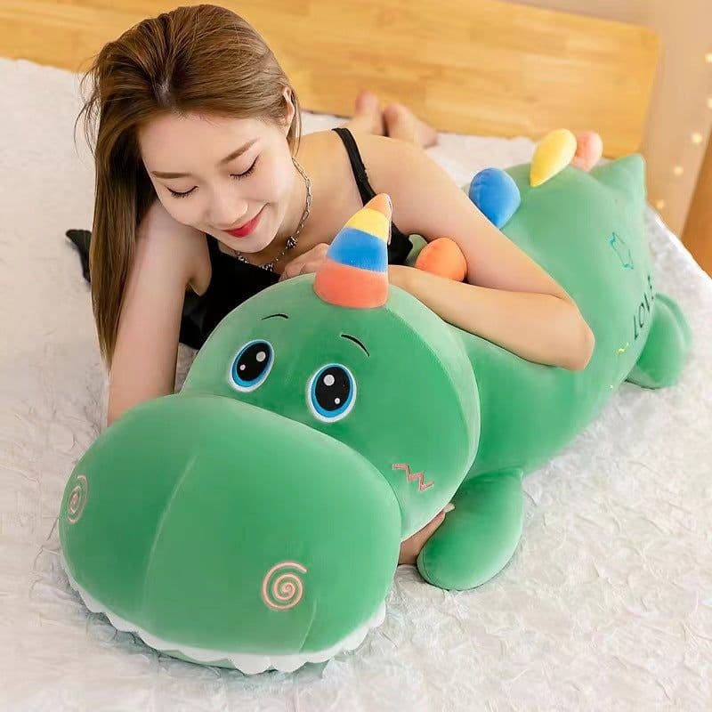 image-Cartoon large long dinosaur plush toy doll for girls to sleep on bed with legs folded and pillow as a birthday gift for girls