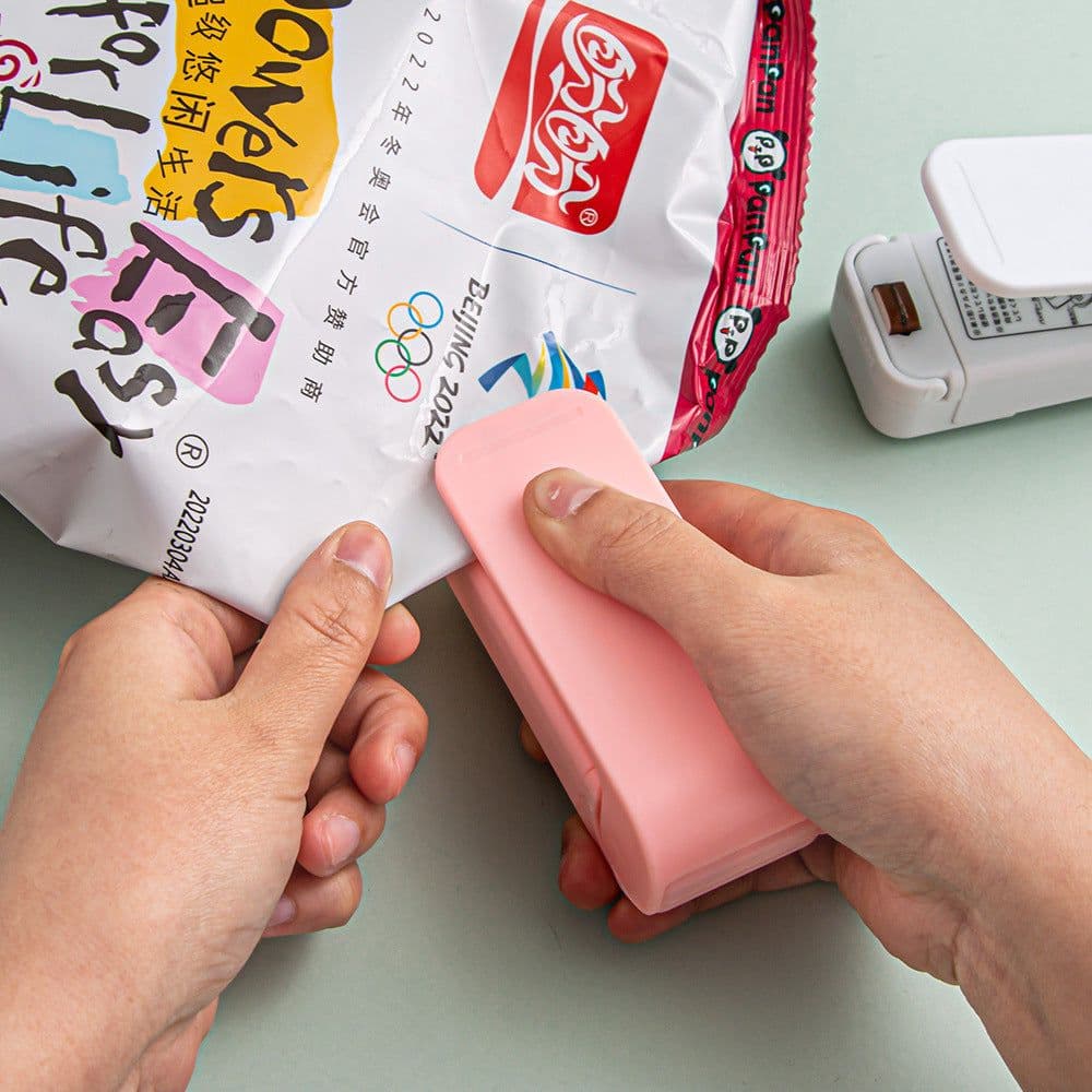 image-Mini Portable Hand Pressure Sealer Plastic Bag Packaging Small Household Snack Sealer Plastic Sealing and Keeping Fresh
