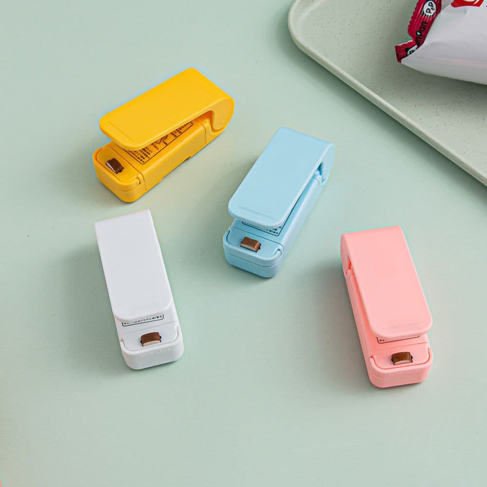 image-Mini Portable Hand Pressure Sealer Plastic Bag Packaging Small Household Snack Sealer Plastic Sealing and Keeping Fresh