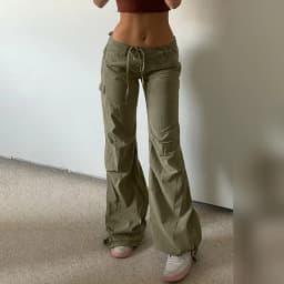 image-European and American style women's clothing 2022 spring fashion bow tie pocket overalls low waist slim casual leggings