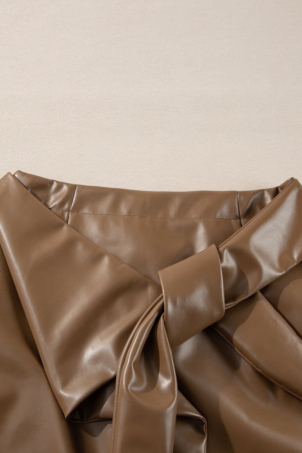 image-Faux Leather Bowknot Mini Skirt - Chic, Playful, 60" Length