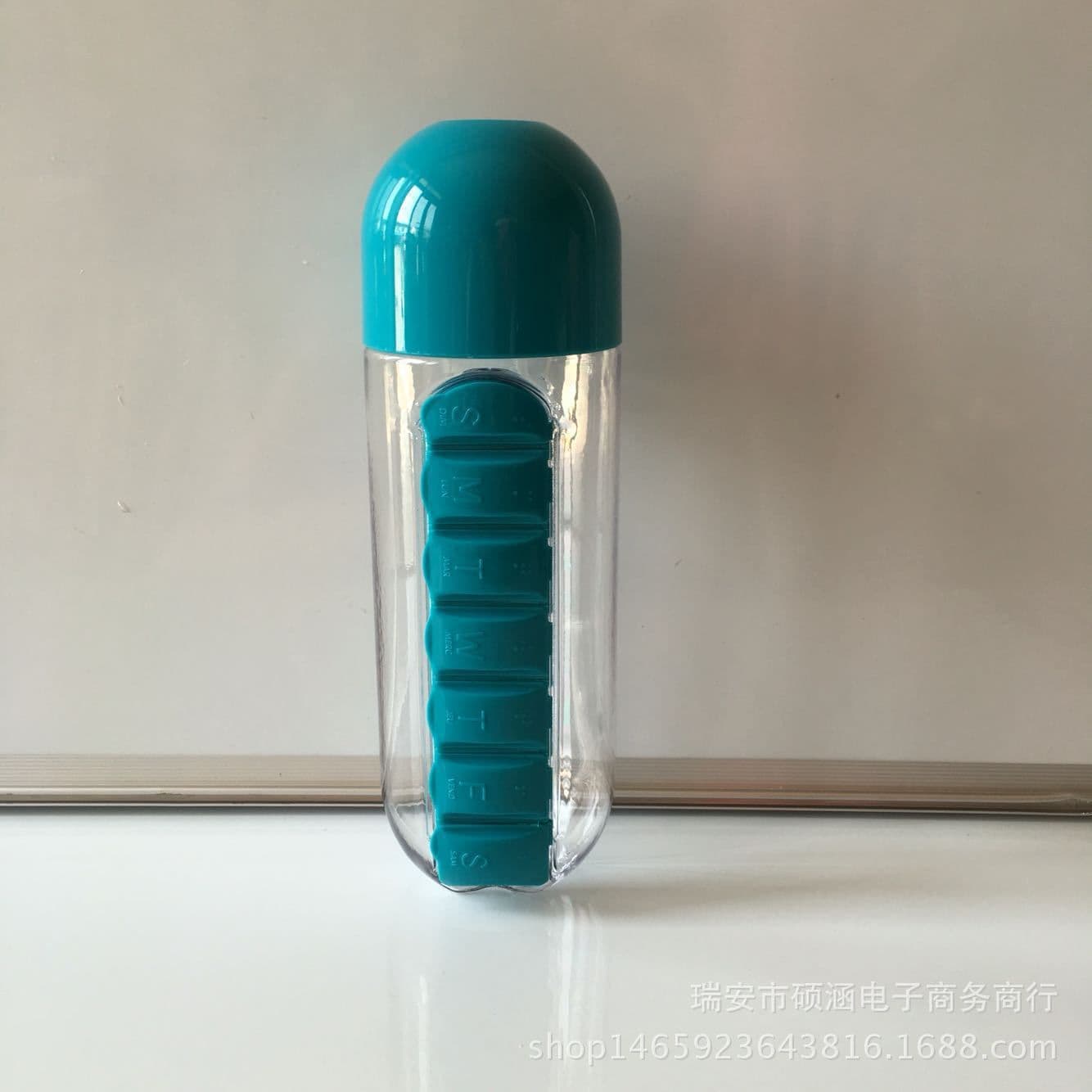 image-Creative with medicine box cup with seven-day portable medicine box Two in one outdoor carrying water bottle Pill cup