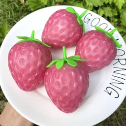 image-Simulated Colorful Strawberry Squeezing Music To Vent