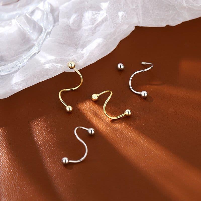image-Curved spiral earrings, personality, cool style, rotating ear bone nails, no-removal earrings for sleeping, round bead screw-buckle earrings