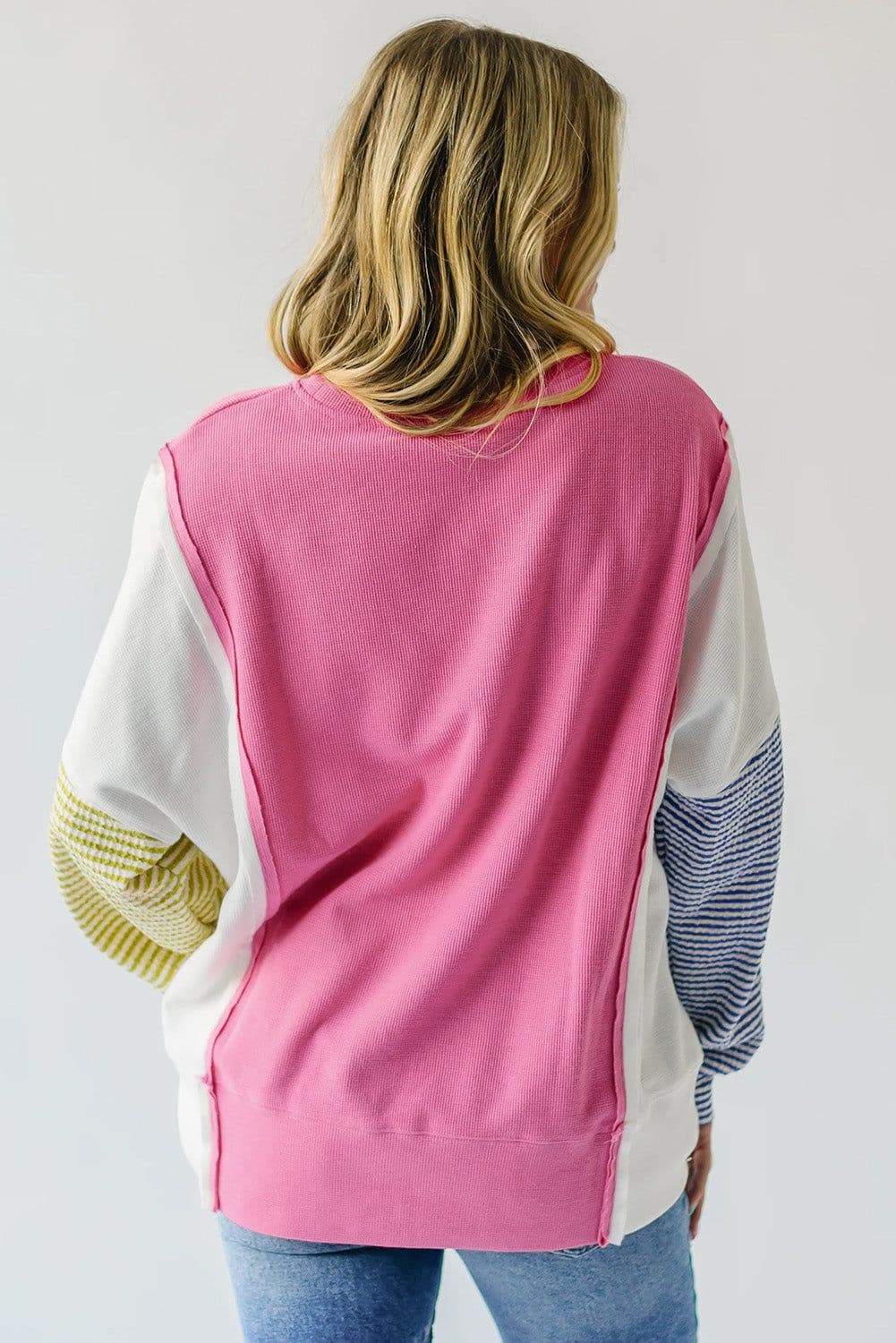 image-Pink Striped Color Block Top with Exposed Seams Long Sleeves