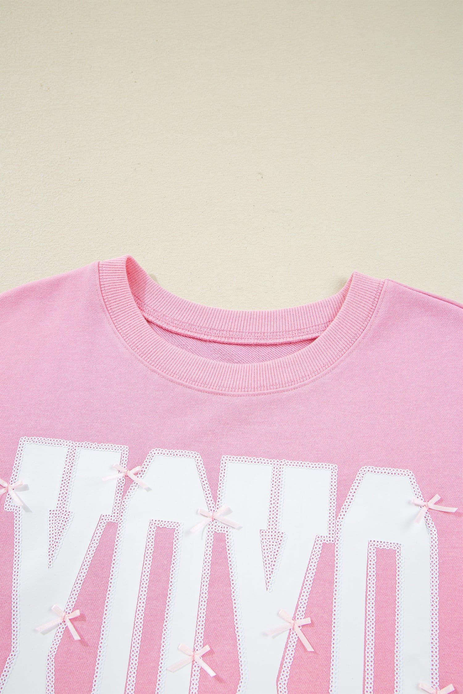 image-Pink Bow Sequin XOXO Letter Graphic Exposed Seam Baggy Sweatshirt