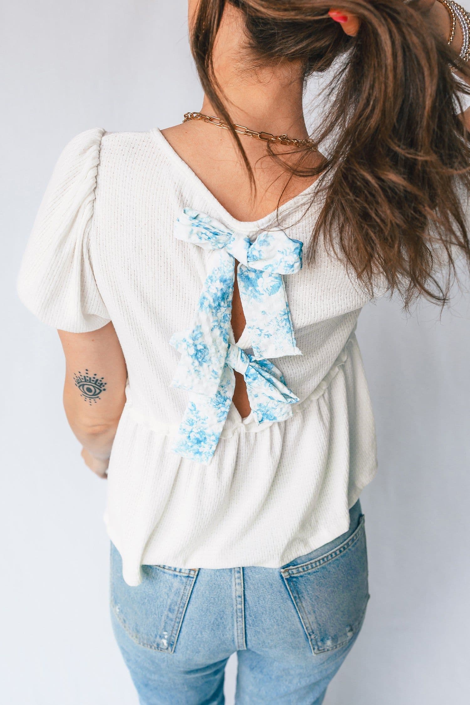 image-White Textured Knit V Neck Short Bubble Sleeve Peplum Top