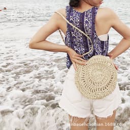 image-Handmade Round Straw Woven Crossbody Bag with Tassel