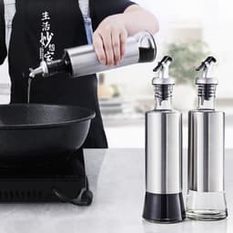 image-Glass Oil Dispenser Bottle with Stainless Steel Sleeve and Funnel