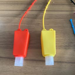 image-Cartoon Silicone Hand Sanitizer Bottle Holder with Cover