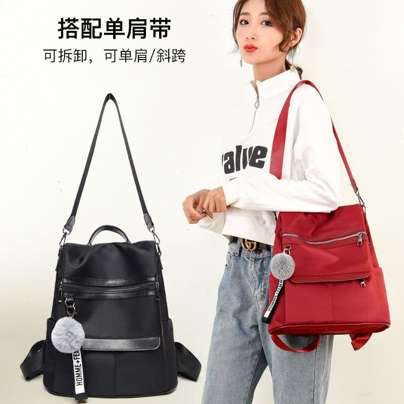 image-Women's Nylon Backpack with Pom Pom - Solid Color Commuter Bag