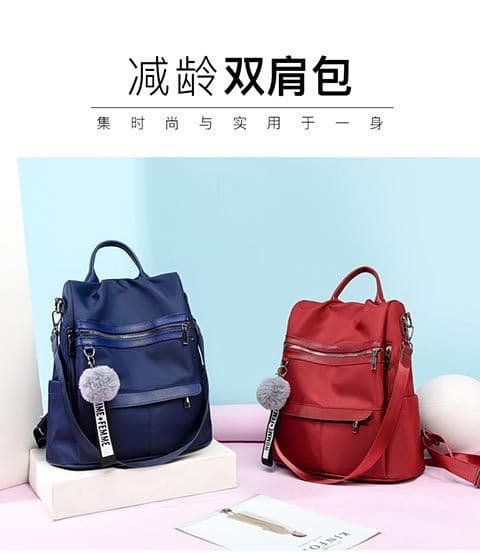 image-Women's Nylon Backpack with Pom Pom - Solid Color Commuter Bag
