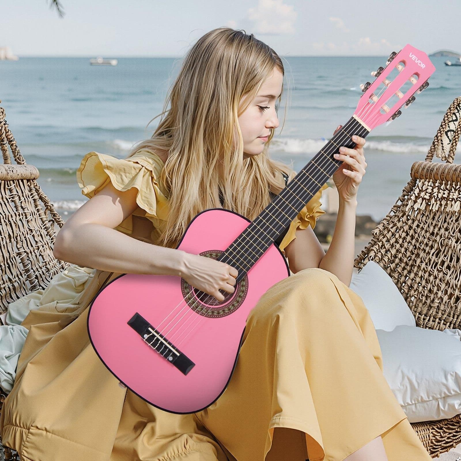 image-VEVOR Classical Guitar, 30 Inch, Wood Classical Guitar Starter Kit for Beginners, with Nylon Strings, Gig Bag, Strap, Tuner, Extra Strings, Picks, Capo, Basswood, for Kids Girls Boys Students, Pink
