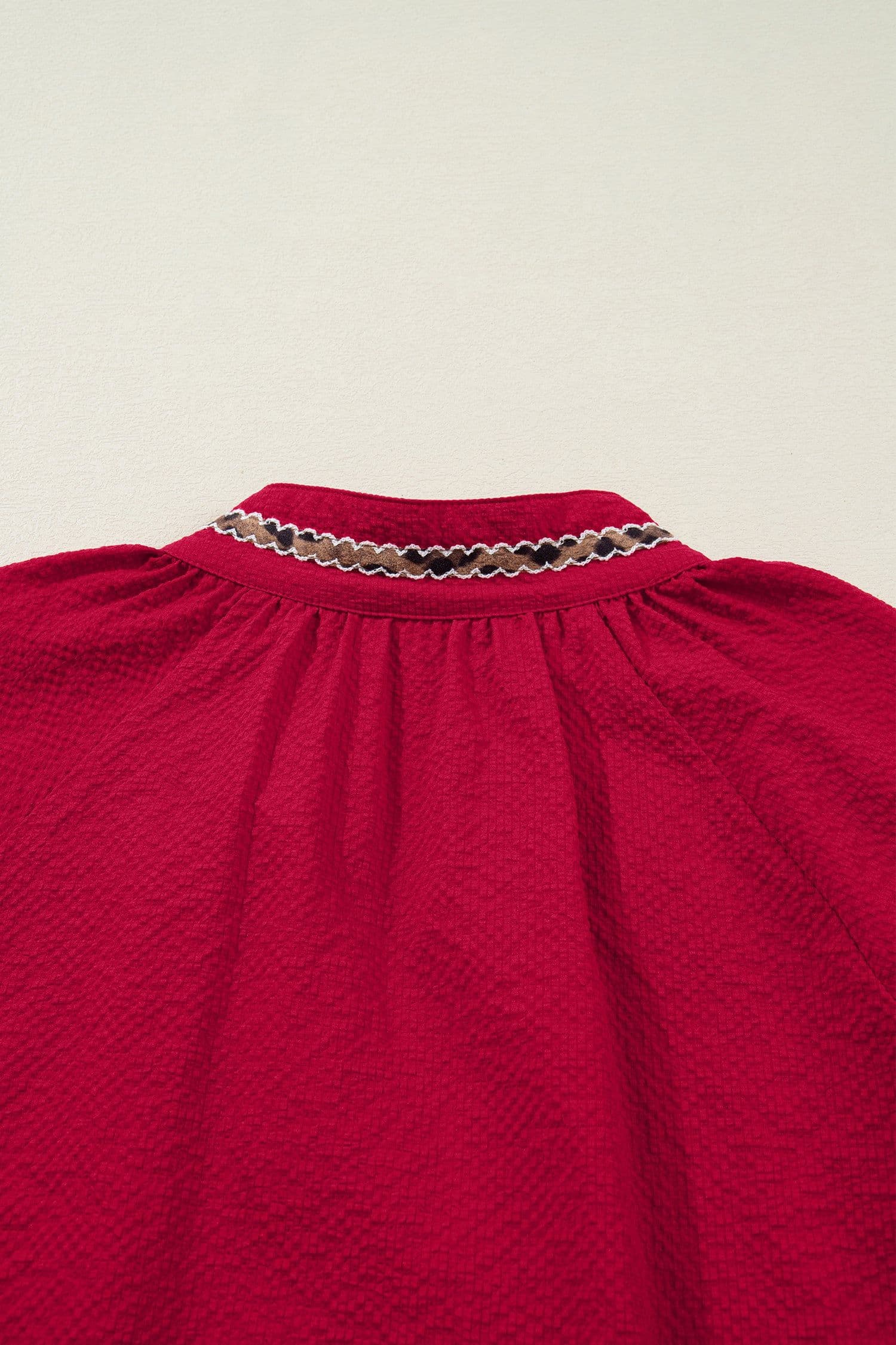image-Racing Red Leopard Jacquard Print V Neck Textured Blouse