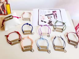 image-Colorful punk bracelet made with silk cord and silver plated Charms.