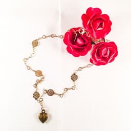 image-Bronze Heart Charm Necklace with 18kt Gold Plated Flower Chain.