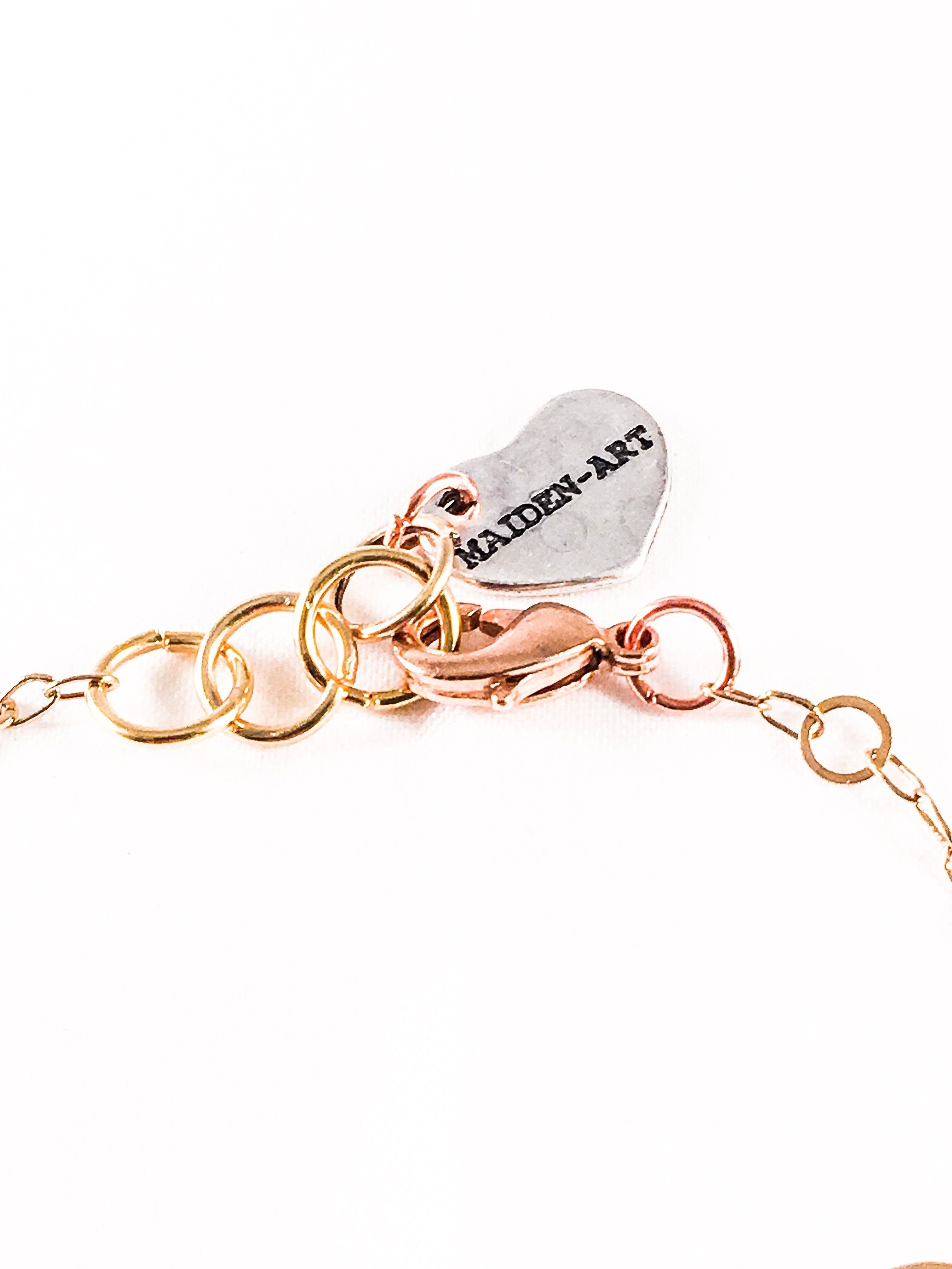 image-Bronze Heart Charm Necklace with 18kt Gold Plated Flower Chain.