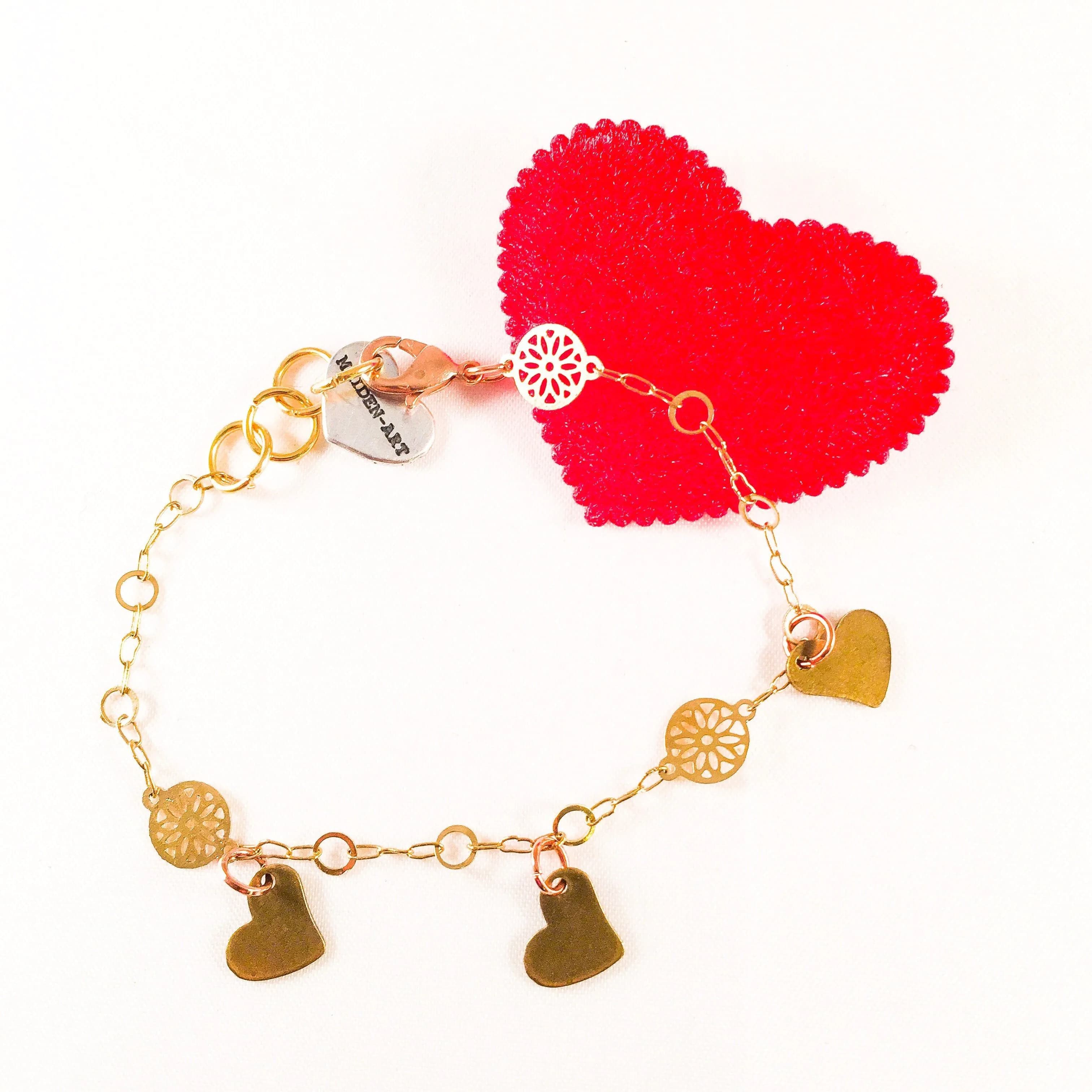 image-Triple Bronze Heart Charms Bracelet with 18kt Gold Plated Flower
