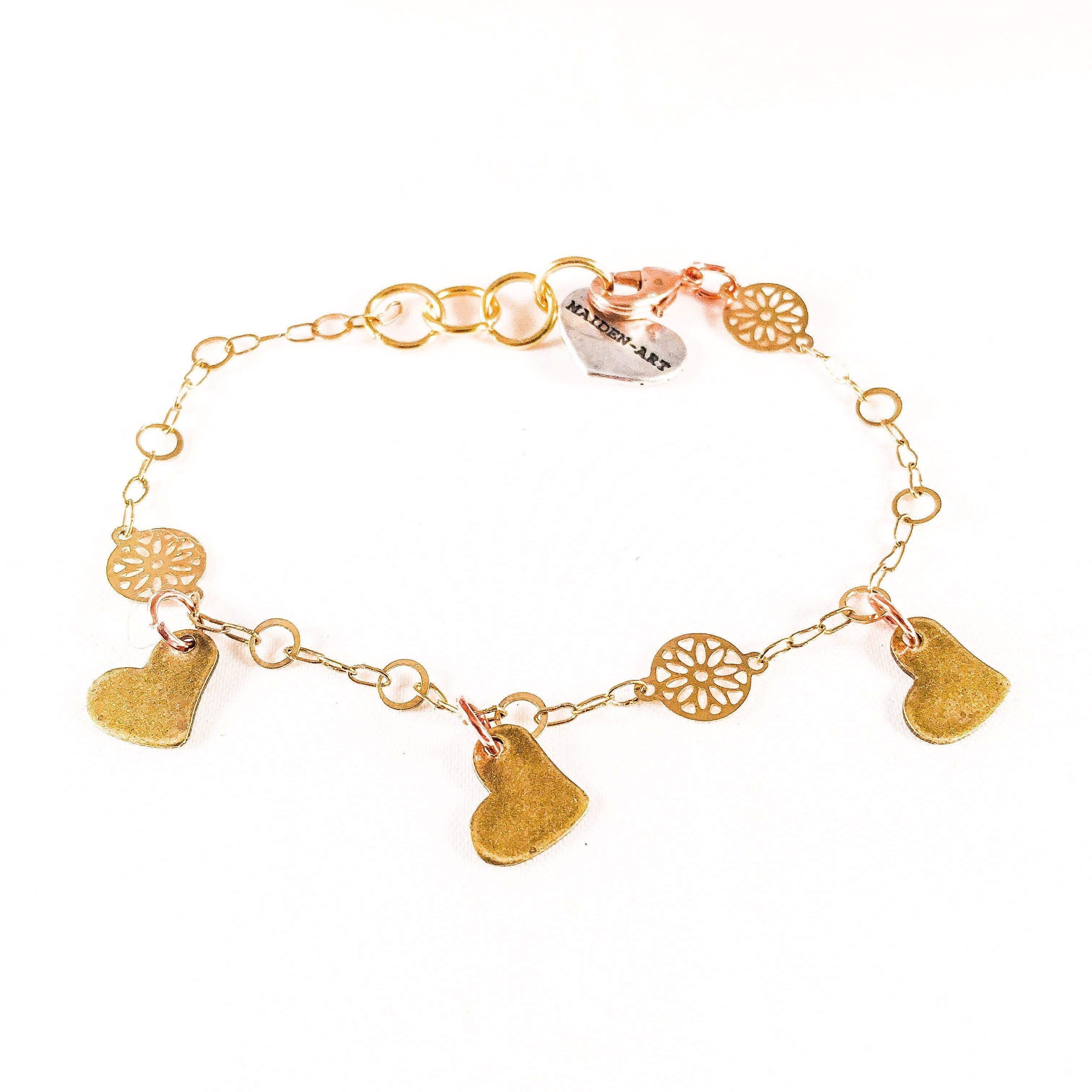 image-Triple Bronze Heart Charms Bracelet with 18kt Gold Plated Flower