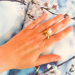 image-Statement ring in gold with rose gold cross charm