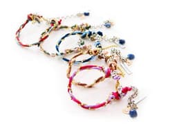 image-Charm bracelet with Lapis lazuli stones, crystals and silk cord.