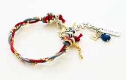 image-Charm bracelet with Lapis lazuli stones, crystals and silk cord.