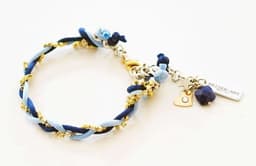 image-Charm bracelet with Lapis lazuli stones, crystals and silk cord.