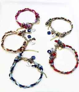 image-Charm bracelet with Lapis lazuli stones, crystals and silk cord.