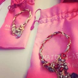 image-Charm bracelet with Lapis lazuli stones, crystals and silk cord.