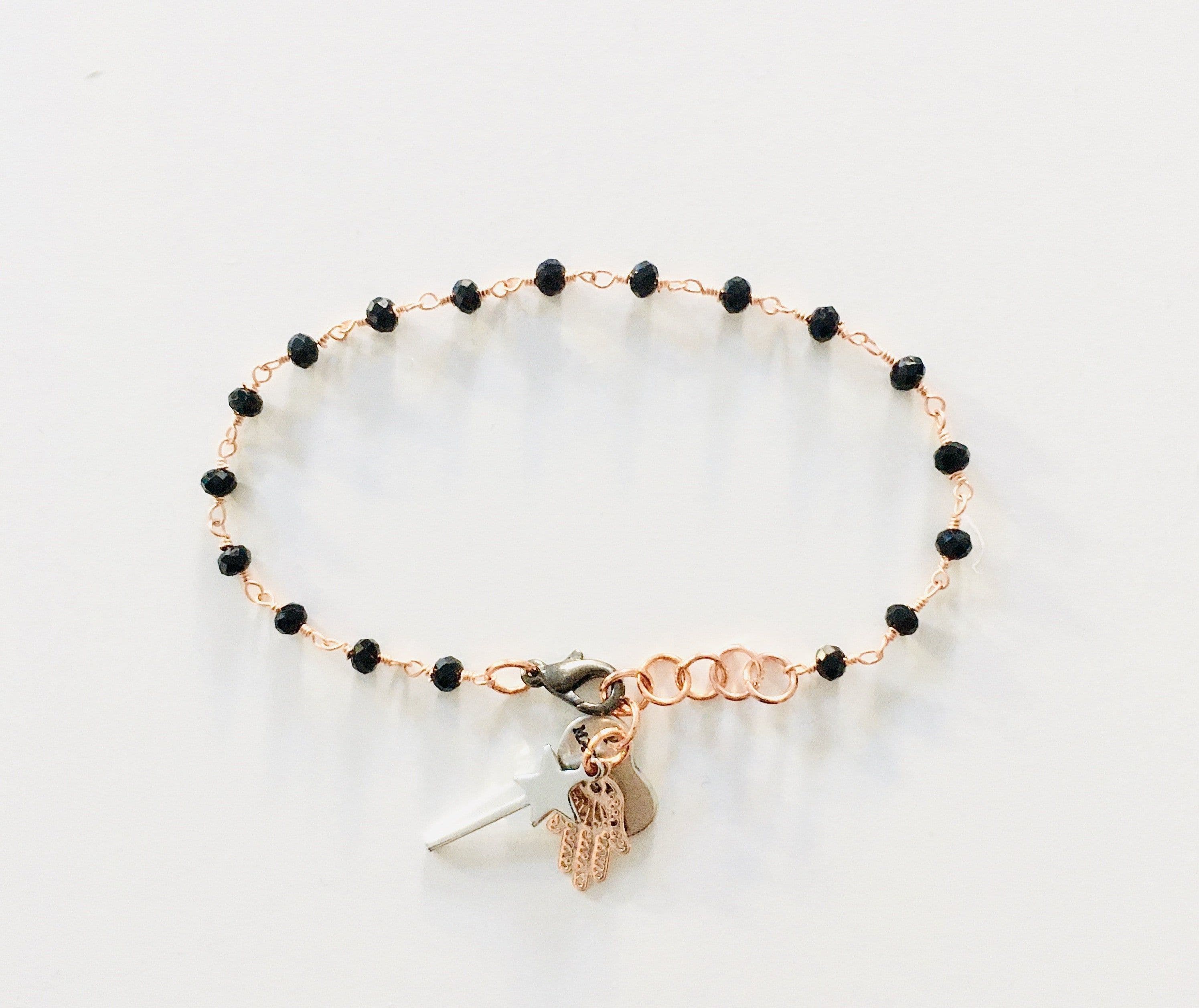 image-Rosary bracelet with magic wand and hamsa charm. Spinels Bracelet.
