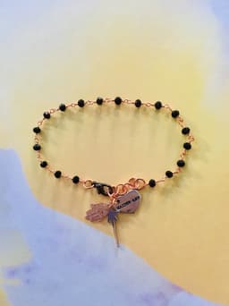 image-Rosary bracelet with magic wand and hamsa charm. Spinels Bracelet.