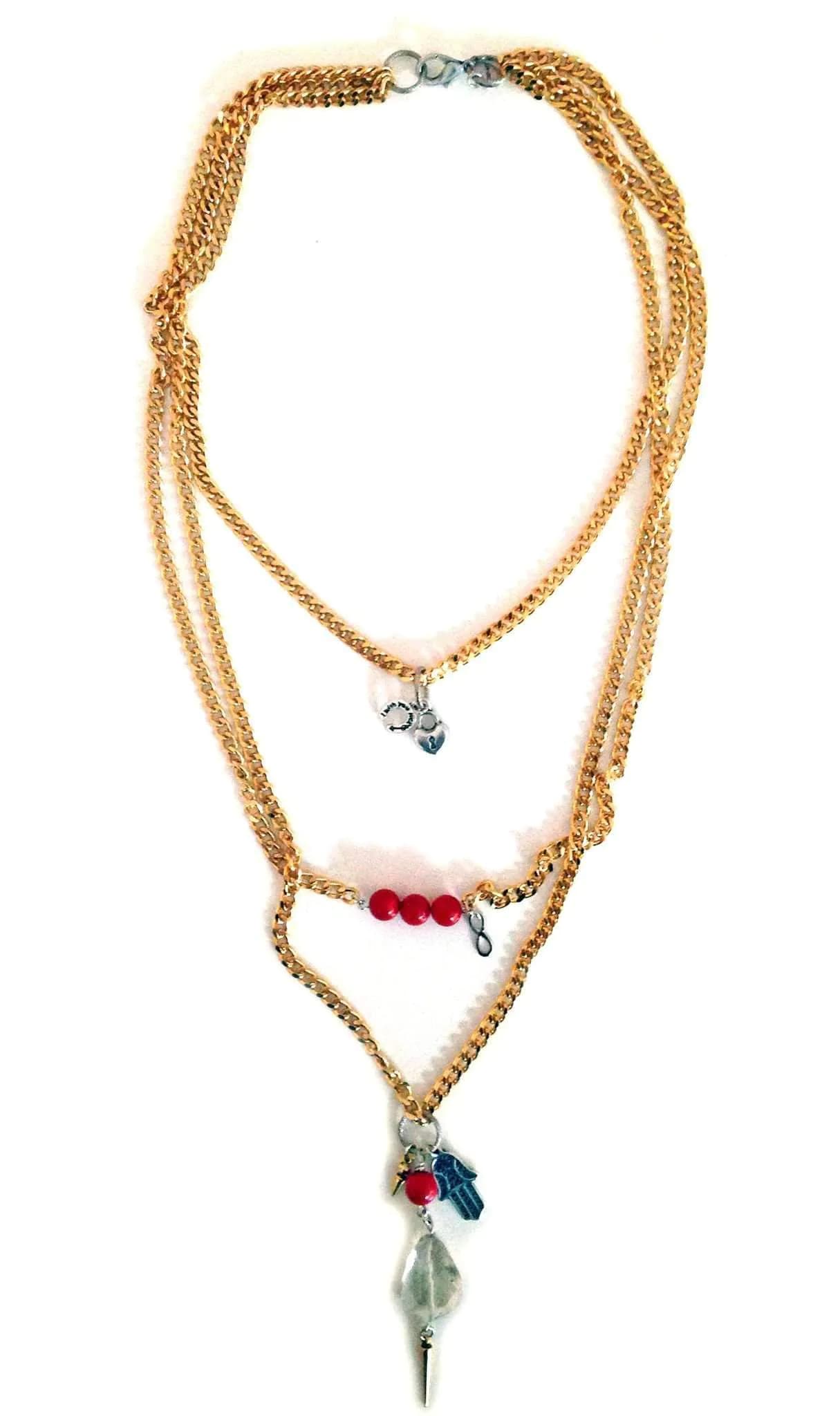 image-Layered necklace in gold, coral and hamsa.